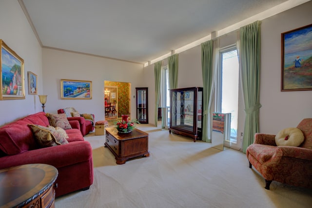 living area featuring ornamental molding and light colored carpet