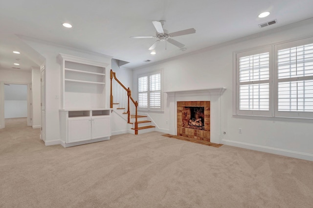 unfurnished living room with stairs, light carpet, visible vents, and baseboards