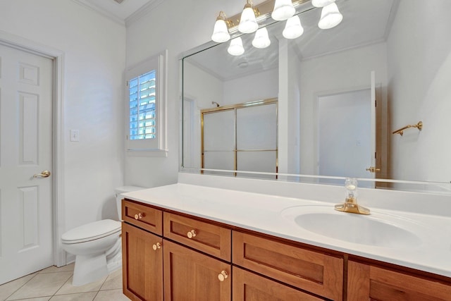 bathroom featuring tile patterned flooring, toilet, vanity, ornamental molding, and a stall shower