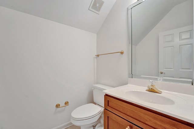 half bathroom with toilet, lofted ceiling, visible vents, and vanity