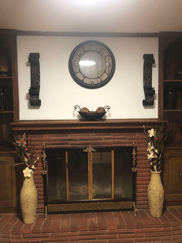 details featuring a brick fireplace