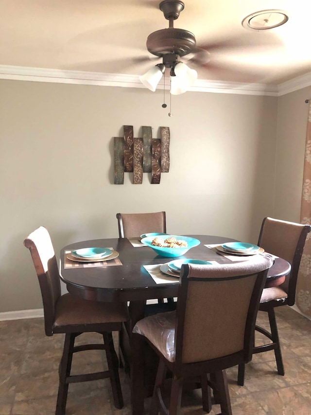 dining area with ceiling fan, ornamental molding, and baseboards