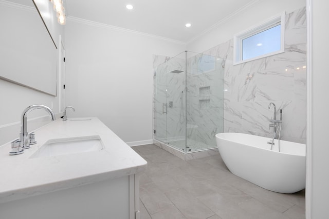 bathroom with double vanity, a marble finish shower, crown molding, a freestanding bath, and a sink