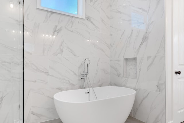 full bathroom featuring a soaking tub