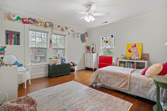 bedroom featuring dark wood-style flooring, visible vents, and crown molding