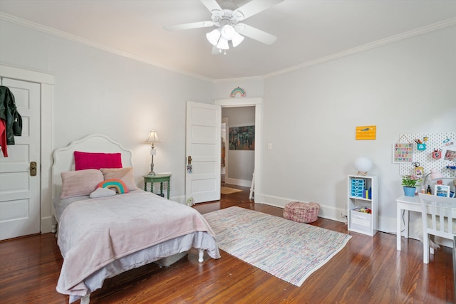 bedroom featuring baseboards, dark wood-style flooring, a ceiling fan, and crown molding