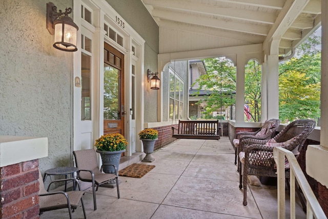 view of patio featuring a porch