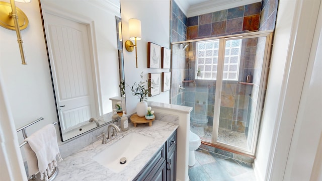 bathroom featuring ornamental molding, a stall shower, vanity, and toilet