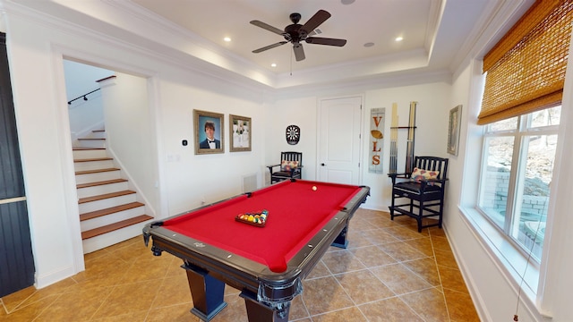 game room with light tile patterned floors, pool table, a tray ceiling, and crown molding