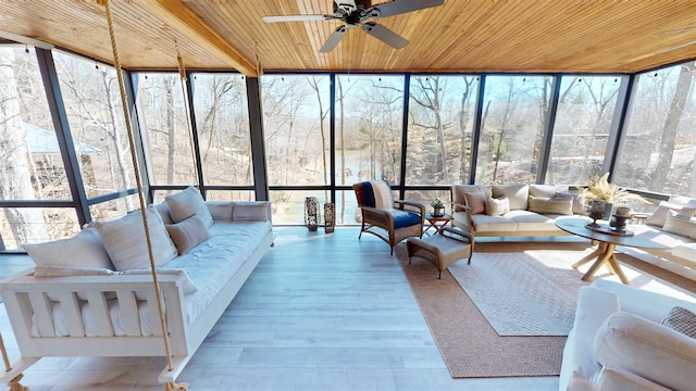 sunroom with wooden ceiling and ceiling fan