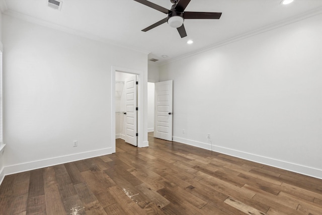 unfurnished bedroom with dark wood-style floors, crown molding, visible vents, and baseboards