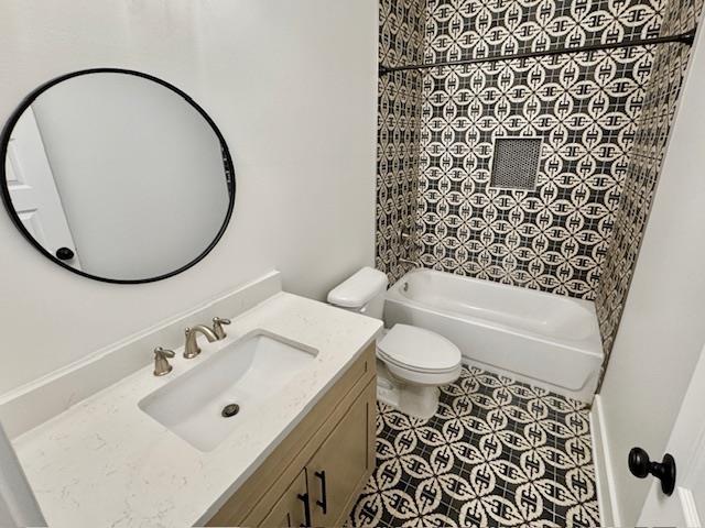 full bath featuring toilet, shower / bathtub combination, tile patterned flooring, and vanity