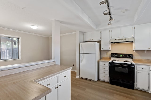 kitchen with light wood-style flooring, freestanding refrigerator, range hood, light countertops, and range with electric stovetop