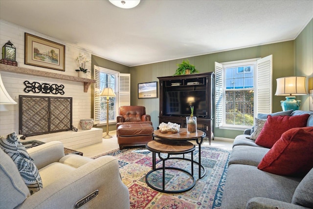 carpeted living room featuring plenty of natural light and a fireplace