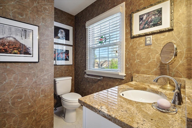 bathroom with vanity and toilet