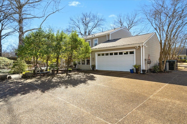 view of property exterior featuring driveway, a shingled roof, and an attached garage