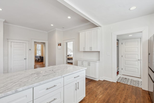 kitchen featuring light stone counters, recessed lighting, white cabinetry, and dark wood finished floors