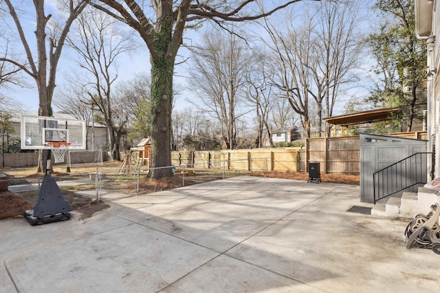 view of patio / terrace with a playground and a fenced backyard