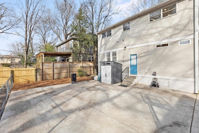 exterior space featuring entry steps, a fenced backyard, and a patio