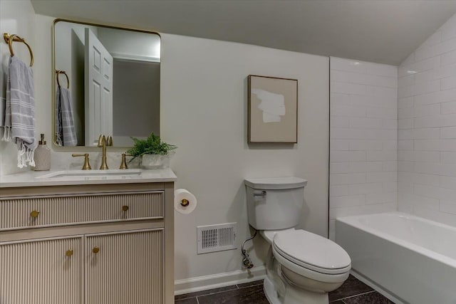 bathroom featuring toilet, vanity, visible vents, vaulted ceiling, and baseboards