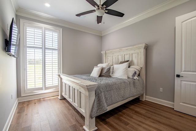 bedroom with dark wood-style floors, ceiling fan, baseboards, and crown molding