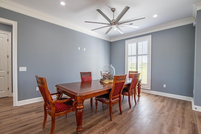 dining area featuring light wood-type flooring, baseboards, and ornamental molding