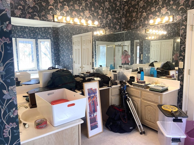 bathroom with wallpapered walls