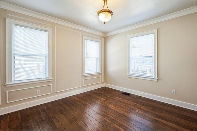 unfurnished room with baseboards, crown molding, visible vents, and dark wood-style flooring