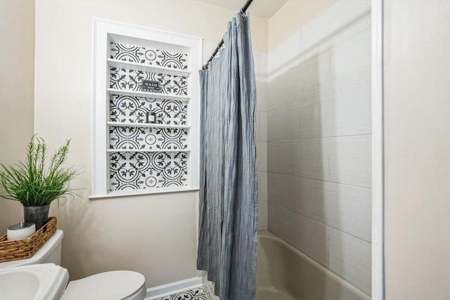 full bath featuring toilet, baseboards, and shower / bath combination with curtain