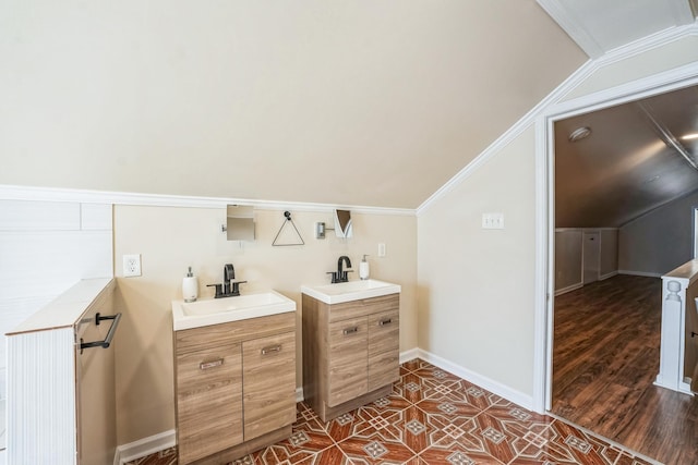 bathroom with lofted ceiling and a sink