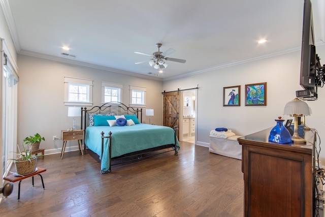 bedroom with dark wood-style flooring, visible vents, a barn door, ornamental molding, and baseboards