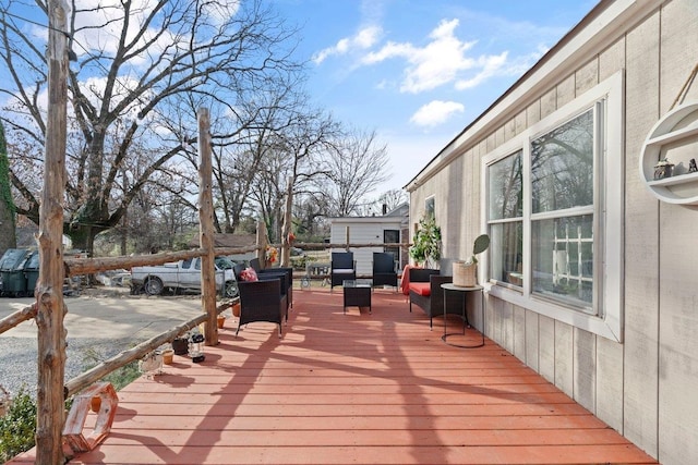 wooden deck featuring outdoor lounge area