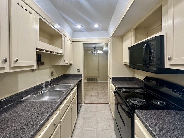 kitchen with black appliances, dark countertops, and a sink