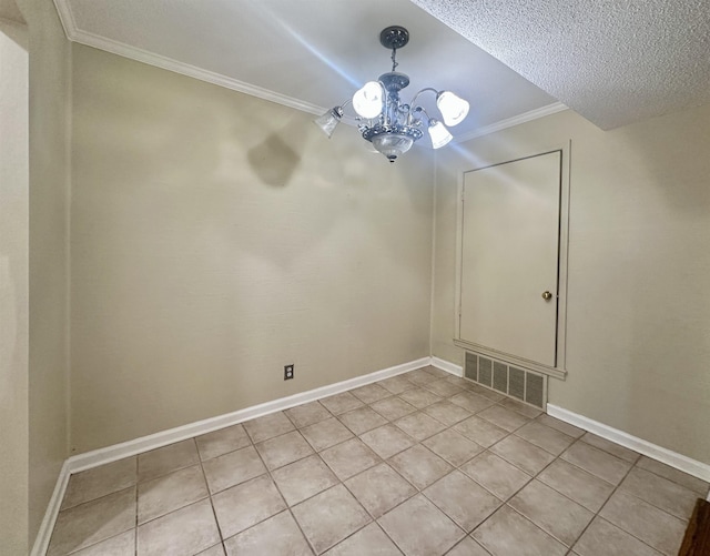 unfurnished dining area with baseboards, visible vents, and ornamental molding