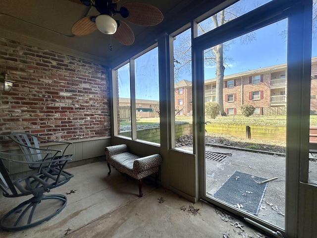 sunroom featuring plenty of natural light and ceiling fan