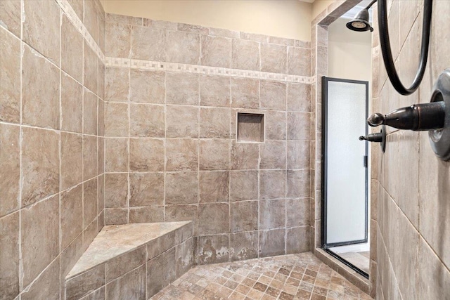 full bathroom featuring tiled shower