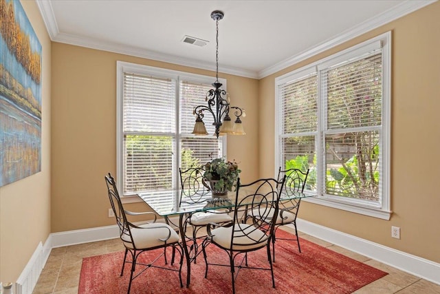 dining space with light tile patterned floors, baseboards, visible vents, and crown molding