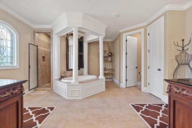 bathroom featuring a garden tub, baseboards, a shower stall, decorative columns, and crown molding