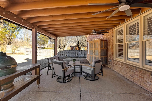 view of patio with ceiling fan, outdoor dining area, and a fenced backyard