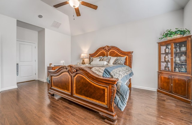 bedroom featuring lofted ceiling, baseboards, visible vents, and dark wood-style flooring