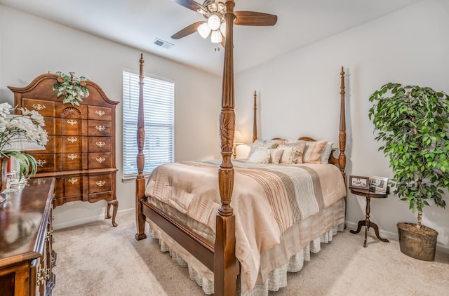 bedroom featuring baseboards, a ceiling fan, visible vents, and light colored carpet