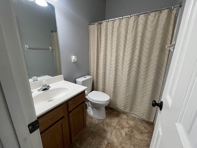 bathroom featuring toilet and vanity