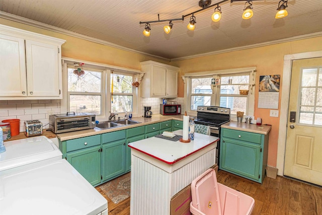 kitchen featuring a kitchen island, white cabinetry, light countertops, and a sink