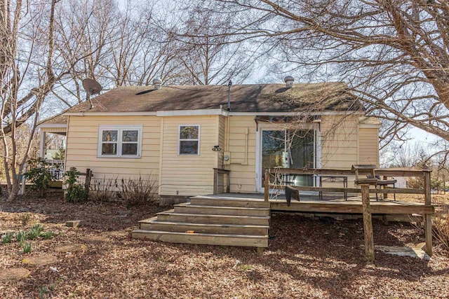 back of house featuring a deck