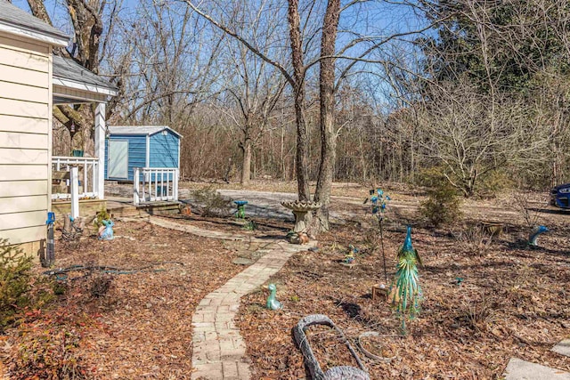 view of yard with an outdoor structure and a shed