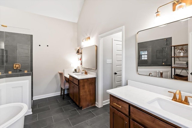 bathroom featuring two vanities, vaulted ceiling, tiled shower, and a sink