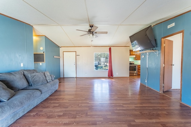 living room featuring visible vents, a ceiling fan, vaulted ceiling, and wood finished floors