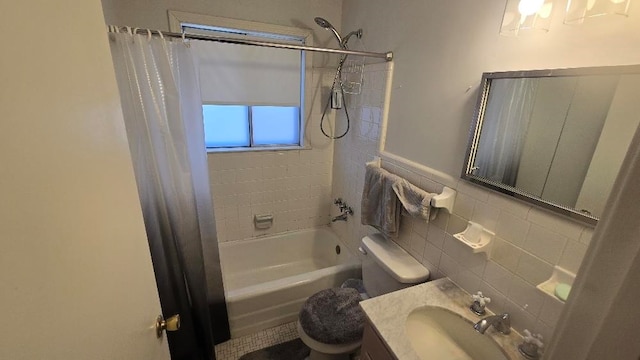 bathroom with shower / tub combo, tile walls, toilet, and vanity