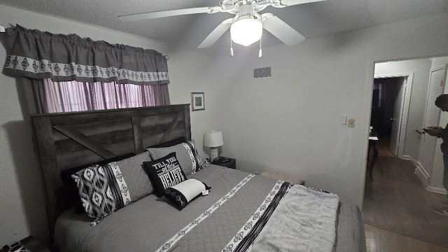 bedroom with ceiling fan and visible vents