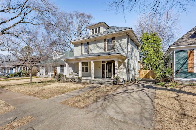 traditional style home featuring covered porch